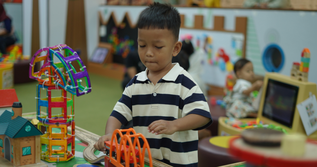 children working with construction blocks